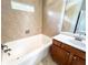 Bathroom featuring tiled tub/shower combo, modern vanity, and neutral color palette at 625 Chestnut St # D, Atlanta, GA 30354