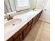 Bathroom with double sinks, a long vanity, and tile flooring at 625 Chestnut St # D, Atlanta, GA 30354