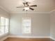 Bedroom showcasing hardwood floors, neutral paint, and bright natural light from two windows at 625 Chestnut St # D, Atlanta, GA 30354