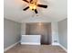 Bonus room with neutral walls, ceiling fan, and access to a staircase at 625 Chestnut St # D, Atlanta, GA 30354