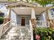 Charming front porch with stone accents and freshly painted steps, inviting entry to this home at 625 Chestnut St # D, Atlanta, GA 30354