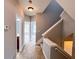 Hallway with carpet flooring, neutral wall paint, and staircase at 625 Chestnut St # D, Atlanta, GA 30354