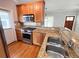 Beautiful kitchen featuring granite countertops, stainless steel appliances, and wood cabinetry at 625 Chestnut St # D, Atlanta, GA 30354