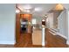 Well-lit kitchen featuring granite countertops, stainless steel appliances, and wood flooring at 625 Chestnut St # D, Atlanta, GA 30354