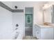 Bathroom with stylish tiles, chrome fixtures, vanity, and a view to another room at 848 Fox Nw St, Atlanta, GA 30318