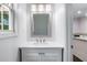Clean bathroom featuring a quartz countertop and ample light from the window at 848 Fox Nw St, Atlanta, GA 30318
