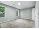 Bright bedroom features plush carpeting, fresh paint, and two windows letting in ample natural light at 848 Fox Nw St, Atlanta, GA 30318