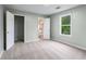 Bedroom with neutral carpet, a window, and a bathroom and closet entrance at 848 Fox Nw St, Atlanta, GA 30318