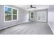 Spacious bedroom with natural light, ceiling fan, neutral carpet, and balcony access at 848 Fox Nw St, Atlanta, GA 30318