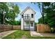 Charming two-story home with balcony, quaint fenced yard and inviting curb appeal at 848 Fox Nw St, Atlanta, GA 30318
