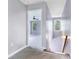Hallway showcasing neutral paint and easy access to upstairs, windows create airy atmosphere at 848 Fox Nw St, Atlanta, GA 30318