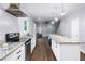 Bright kitchen featuring granite countertops, stainless steel appliances, and an island at 848 Fox Nw St, Atlanta, GA 30318