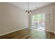 Dining room features sliding glass door to a backyard patio at 9155 Nesbit Ferry Rd # 65, Alpharetta, GA 30022