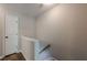 Upstairs hallway with white trim and doors, leading to more rooms at 9155 Nesbit Ferry Rd # 65, Alpharetta, GA 30022