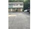 Exterior view of an apartment building with designated parking spaces in front at 4701 Flat Shoals Rd # 41-F, Union City, GA 30291