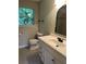 Bathroom with updated vanity, commode and decorative mirror at 4701 Flat Shoals Rd # 41-F, Union City, GA 30291
