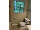 Bathroom featuring a toilet, and a window with natural lighting at 4701 Flat Shoals Rd # 41-F, Union City, GA 30291