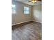 Bedroom featuring laminate floors and a ceiling fan at 4701 Flat Shoals Rd # 41-F, Union City, GA 30291