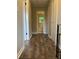 Hallway with wood-look floors leading to a bathroom at 4701 Flat Shoals Rd # 41-F, Union City, GA 30291