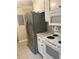 Kitchen featuring white cabinets, tile floor, stainless steel appliances and modern faucet at 4701 Flat Shoals Rd # 41-F, Union City, GA 30291