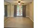 Living room featuring tile floors, French doors, and a ceiling fan with light at 4701 Flat Shoals Rd # 41-F, Union City, GA 30291