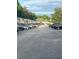 Paved parking lot surrounded by residential units and lush green trees at 4701 Flat Shoals Rd # 41-F, Union City, GA 30291