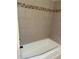 Shower with tiled walls and a neutral finish at 4701 Flat Shoals Rd # 41-F, Union City, GA 30291