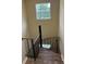 Unique spiral staircase with modern railing and window brightening up the space at 4701 Flat Shoals Rd # 41-F, Union City, GA 30291