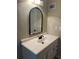 Close-up of a bathroom vanity with stylish fixtures and mirror at 4701 Flat Shoals Rd # 41-F, Union City, GA 30291