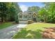 Charming two-story home featuring a well-manicured lawn and inviting curb appeal at 7635 Wynfield Dr, Cumming, GA 30040