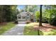 Charming two-story home featuring a well-manicured lawn and inviting curb appeal at 7635 Wynfield Dr, Cumming, GA 30040