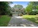 Charming two-story home featuring a well-manicured lawn and inviting curb appeal at 7635 Wynfield Dr, Cumming, GA 30040