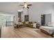 Open-concept living area featuring vaulted ceilings and modern flooring at 7635 Wynfield Dr, Cumming, GA 30040