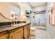 Bathroom featuring stylish vanity, wood-look tile floor, and a glass-enclosed shower at 790 Lakeview Ne Ave, Atlanta, GA 30308