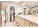 Bathroom featuring double sinks, a large mirror, quartz counters, and a glass shower at 790 Lakeview Ne Ave, Atlanta, GA 30308