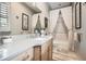 Bright bathroom showcases a tub/shower combo with decorative curtains and a neutral color palette at 790 Lakeview Ne Ave, Atlanta, GA 30308