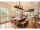 Dining area with hardwood floors, a decorative chandelier, bench seating and double doors at 790 Lakeview Ne Ave, Atlanta, GA 30308