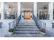 Grand entrance showcasing brick steps, black iron railings, and double doors to the house at 790 Lakeview Ne Ave, Atlanta, GA 30308