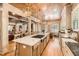 Spacious kitchen featuring a large island with seating, wooden ceiling, and ample counter space at 790 Lakeview Ne Ave, Atlanta, GA 30308