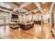 Large living room with wood-beam ceilings, fireplace, and ample seating for comfortable gatherings at 790 Lakeview Ne Ave, Atlanta, GA 30308