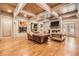 Open living room featuring hardwood floors, fireplace, and exposed wooden beam ceilings at 790 Lakeview Ne Ave, Atlanta, GA 30308