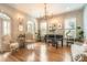 Formal living room with hardwood floors, a piano, and natural light from multiple windows at 790 Lakeview Ne Ave, Atlanta, GA 30308