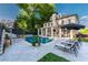 Luxurious backyard featuring a large pool, spa, covered patio, and comfortable lounge chairs at 790 Lakeview Ne Ave, Atlanta, GA 30308
