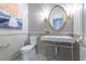 Stylish powder room features wainscoting, decorative tile floors, and a gold-trimmed mirror at 790 Lakeview Ne Ave, Atlanta, GA 30308