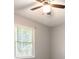 Bedroom features a neutral color scheme, plush carpet, and a ceiling fan at 1353 Litchfield Ct, Snellville, GA 30078