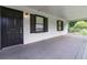 Charming front porch features fresh paint, black shutters, and ample space for outdoor seating at 1353 Litchfield Ct, Snellville, GA 30078