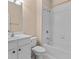 Bathroom featuring a vanity, toilet, and shower-over-tub with white tile surround at 1973 Cobblestone Cir, Brookhaven, GA 30319
