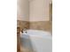Bathroom featuring a soaking tub with tile backsplash and bronze faucet at 1973 Cobblestone Cir, Brookhaven, GA 30319