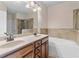 Bathroom with double sink vanity, soaking tub and step-in shower with glass door at 1973 Cobblestone Cir, Brookhaven, GA 30319