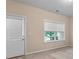 Bedroom featuring a door to the outside, a window and neutral carpet at 1973 Cobblestone Cir, Brookhaven, GA 30319